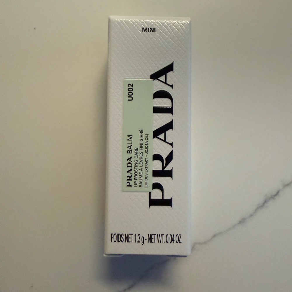 Prada banana Lip Balm in Silver Case - mini size. NIB.